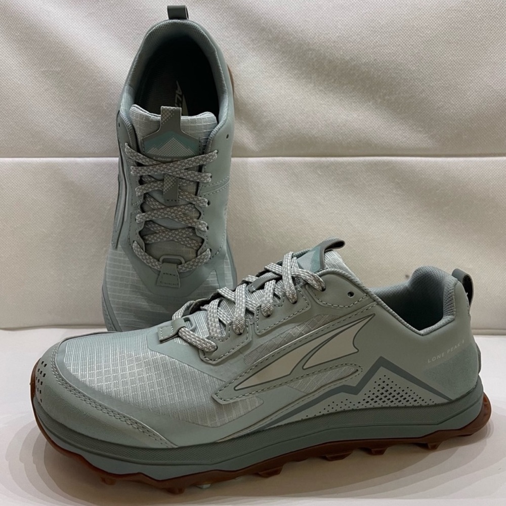 Altras lone peak5 hiking/ trail running shoes. Worn once, too big for me.